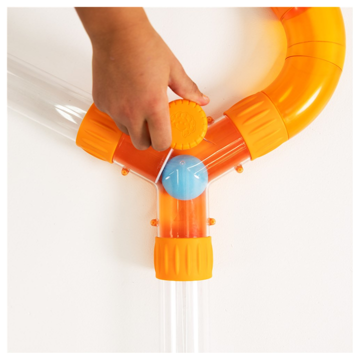 Hand turning the Air Toobz Switch to redirect a foam ball